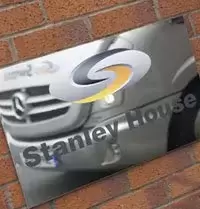 Swans coach reflected in sign